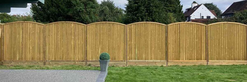 Arched Fence Panels Create Decorative Boundary